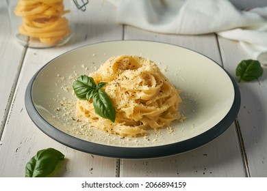 italian pasta fettuccine alfredo with butter parmesan cheese on white background - Powered by Shutterstock