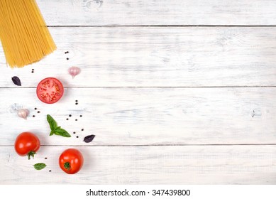 Italian Pasta Ingredients On White Wooden Table, Top View, Copy Space