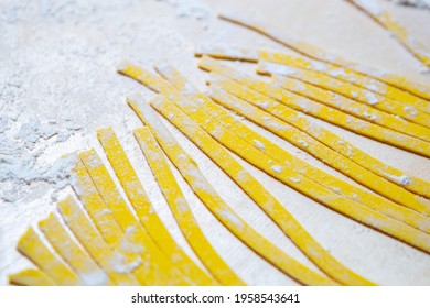 Italian Pasta Noodles Prepared With Wholegrain Wheat Flour On Wooden Table In Restaurant Kitchen.tagliatelle Preparation.Download Royalty Free Curated Images Collection With Foods On Shutterstock