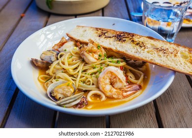 Italian Pasta With Shrimp, Clam, Linguine, Roasted Tomato, Cipollini Onion And Saffron Broth