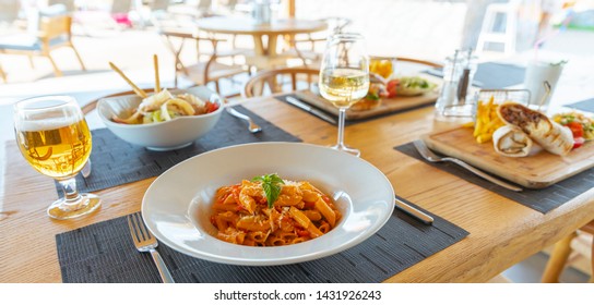 Italian Penne Bolognese with White Wine At Summer Beach - Powered by Shutterstock