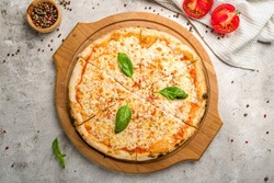 Italian Pizza Margherita With Cheese, Tomato Sauce And Basil On Grey Concrete Table Top View