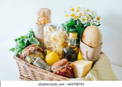 Italian Products. Italian Traditions. Ingredients. Healthy Food. Basket With Products. Basket With A Gift. Food Delivery. A Food Set. White Wooden Table.