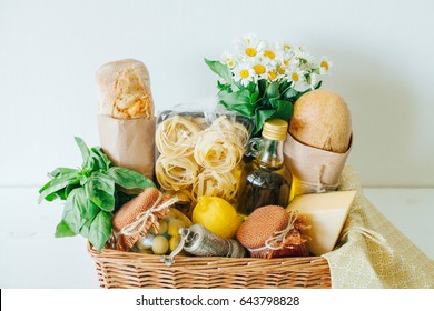 Italian Products. Italian Traditions. Ingredients. Healthy Food. Basket With Products. Basket With A Gift. Food Delivery. A Food Set. White Wooden Table.