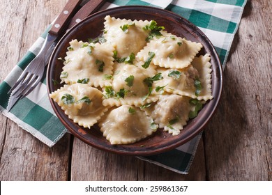 Italian Ravioli On A Plate With Herbs. Horizontal View From Above, Rustic Style
