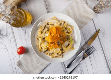 Italian ravioli pasta with dried pumpkins chips, spinachand  and sauce. Italian food. Italian tortellini pasta with creamy sauce, pesto, nuts, seeds - Powered by Shutterstock