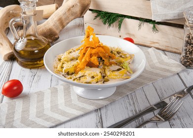 Italian ravioli pasta with dried pumpkins chips, spinachand  and sauce. Italian food. Italian tortellini pasta with creamy sauce, pesto, nuts, seeds - Powered by Shutterstock