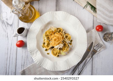 Italian ravioli pasta with strachetella. Italian food. Italian tortellini pasta with onion chips - Powered by Shutterstock