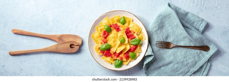 Italian Ravioli With Red Tomato Sauce And Basil, Overhead Flat Lay Panorama With A Fork And Wooden Spoons