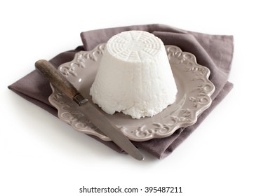 Italian Ricotta Cheese With Knife On Napkin  Isolated On White