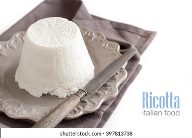 Italian Ricotta Cheese With Knife On Napkin  Isolated On White