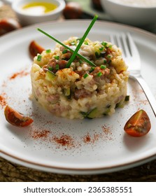 Italian rissoto with pork sausage and vegetables. - Shutterstock ID 2365385551