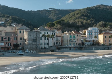 Italian Riviera, Ligurian Sea. Seascape. Bright houses on the seashore and on the background of mountains - Shutterstock ID 2300712781