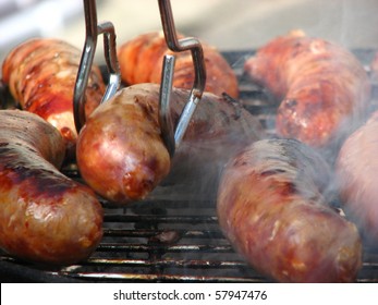 Italian Sausage On Grill With Smoke