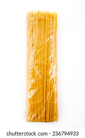 Italian spaghetti in transparent package on white background