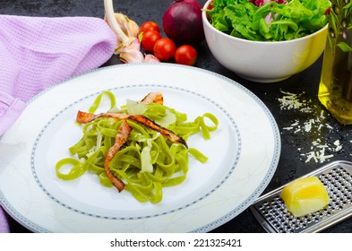 Italian spinach pasta with organic garlic, bacon and parmesan - Powered by Shutterstock