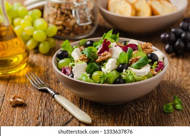 Italian spring salad with goat cheese, grapes and walnuts. Served with croutons. - Powered by Shutterstock