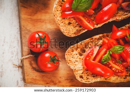 Similar – Image, Stock Photo Bruschetta with cream cheese, cherry tomatoes and basil