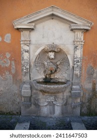 Italian stone carved dragon water fountain architectural detail.