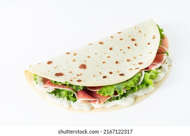 Italian Street Food Flat Lay With Piadina Isolated On A White Background.  Piadina Romagnola - Italian Flatbread With Prosciutto, Salad And Cream Cheese