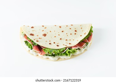 Italian Street Food Flat Lay With Piadina Isolated On A White Background.  Piadina Romagnola - Italian Flatbread With Prosciutto, Salad And Cream Cheese