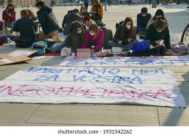 Italian students protest against the government's choice to close schools by following remote lessons on the sidewalk Turin Italy March 8 2021