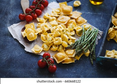 Italian stuffed pasta, tortellini, ravioli with cherry tomatoes. 