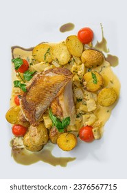 Italian style grilled skate wings on artichoke ragout and trilled potatoes