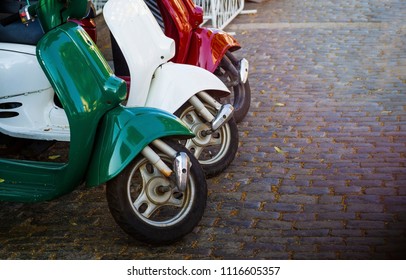 Italian Style Vintage Scooter Parked On Sidewalk.