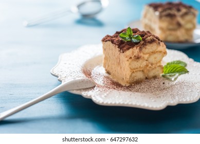 Italian Tiramisu Dessert On A Porcelain Plate