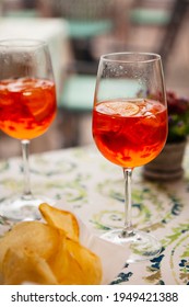 Italian Traditional Food And Aperitif In The Northern Italy, Lombardy, Milan. Two Glasses Of An Alcoholic Cocktail 