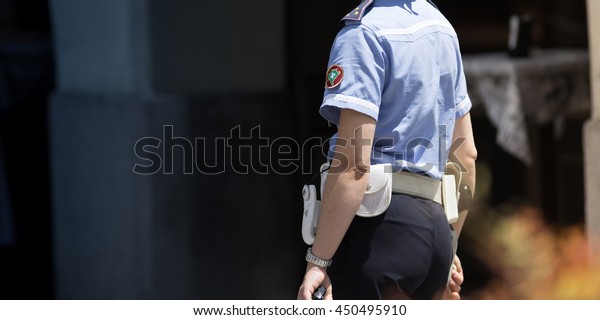 Italian\
traffic officer working outdoor in the\
traffic