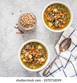 Italian vegetable lentil spinach soup. Top view, space for text. 