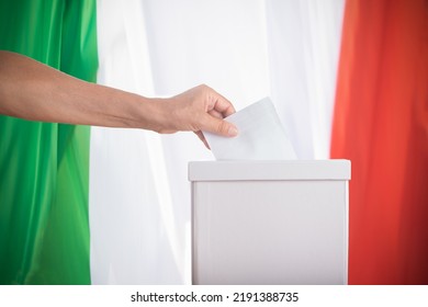 Italian Vote. A close up of a woman hand putting blank ballot in box Democracy concept. - Shutterstock ID 2191388735