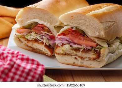 Italian-American Chicken Fried Steak Sandwich Hogie With Shredded Lettuce Tomato Hot Peppers And Red Onion