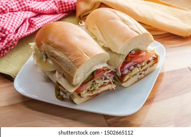 Italian-American Chicken Fried Steak Sandwich Hogie With Shredded Lettuce Tomato Hot Peppers And Red Onion