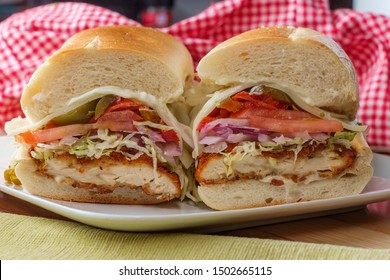 Italian-American Chicken Fried Steak Sandwich Hogie With Shredded Lettuce Tomato Hot Peppers And Red Onion