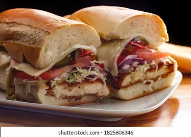 Italian-American Chicken Fried Steak Sandwich Hogie With Shredded Lettuce Tomato Hot Peppers And Red Onion