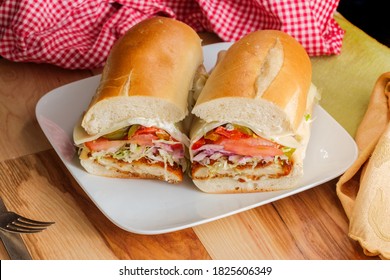 Italian-American Chicken Fried Steak Sandwich Hogie With Shredded Lettuce Tomato Hot Peppers And Red Onion