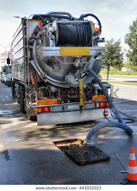 ITALY, CAORLE,15, APRIL,\
2016, cleaning truck pumps out the water drain, ITALY, CAORLE,15,\
APRIL, 2016