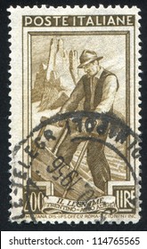 ITALY - CIRCA 1950: stamp printed by Italy, shows Woodcutter, circa 1950