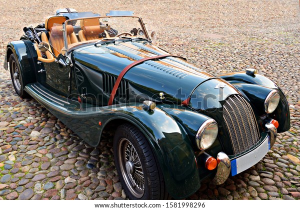 Italy,\
December 2019\
Morgan Plus car in green color. The Morgan Motor\
Company is a historic British car manufacturer that has handcrafted\
a small number of sports cars in the retro\
line