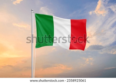 Italy flag waving on sundown sky