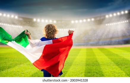 Italy Football Supporter On Stadium. Italian Fans On Soccer Pitch Watching Team Play. Group Of Supporters With Flag And National Jersey Cheering For Italia. Championship Game. Forza Azzurri