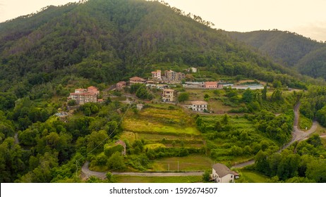 Italy. Forest covered mountains and villas. The territory of Pignone in the region of Liguria, in the province of La Spezia, Aerial View   - Shutterstock ID 1592674507