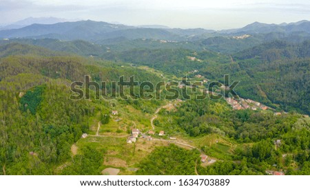 Italy. Forest covered mountains and villas. The territory of Pignone in the region of Liguria, in the province of La Spezia, Aerial View  