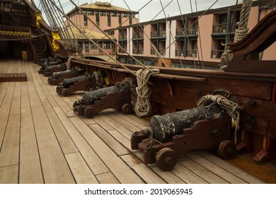 ITALY, GENOA , 24 FEBRUARY 2020. Cannons on the deck of the Neptune galleon in the harbor of Genoa, Italy.  The Neptune is a ship replica of a 17th-century Spanish galleon. 
