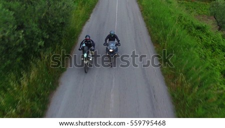 italy, hills of tuscany, camera car of Two motorcyclists on mountain highway having fun and enjoying road, no logos shot NO LOGOS in the shoot