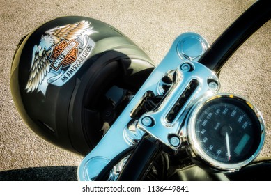 Italy, July 2018 - Helmet Hanging On The Harley Davidson Motorcycle On Show In Pesaro