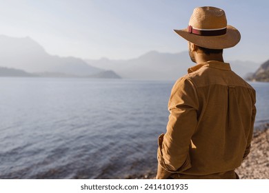 Italy- lierna- back view of man looking at lake - Powered by Shutterstock